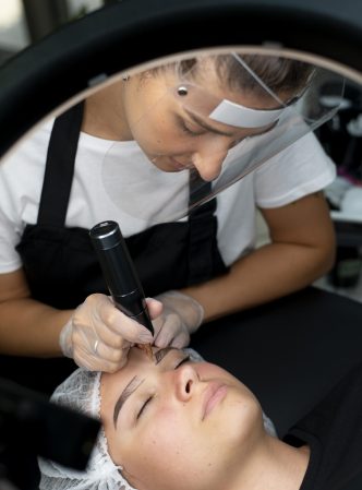 beautician-doing-microblading-procedure-woman-beauty-salon