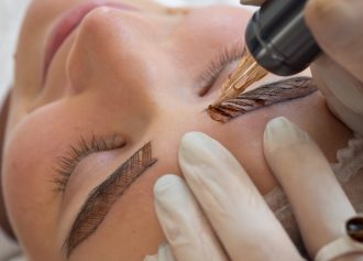 female-client-going-through-microblading-treatment