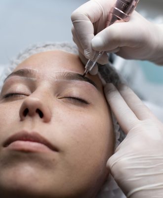 young-woman-going-through-microblading-treatment