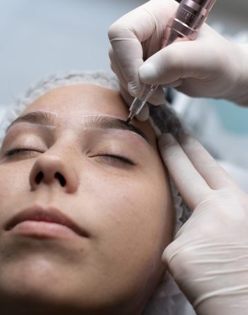 young-woman-going-through-microblading-treatment
